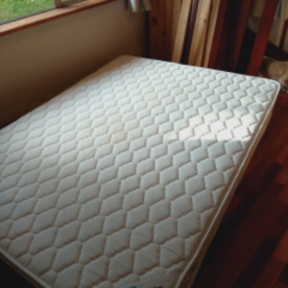 Padded queen sized bed base and wooden bed frame