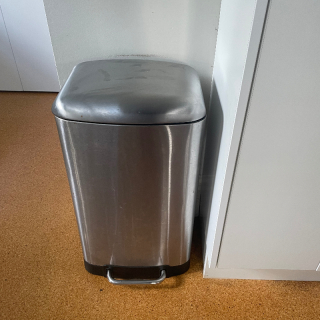 Tall ish rubbish bin.  Good condition and working order 