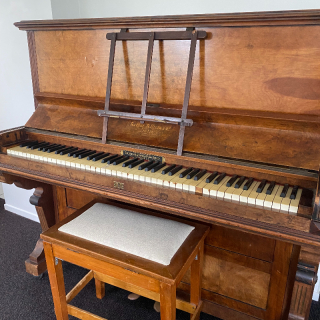 Arthur Allison & Co piano with seat. Manufactured by The English & Foreign Piano Agency 