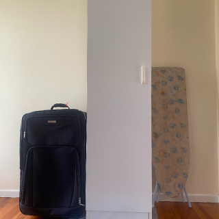 Cupboard, Ironing board and suitcase