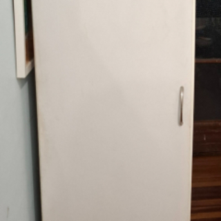 Single door tall cabinet w shelves 