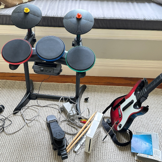 Wii Drums Guitar and Console. Needs work