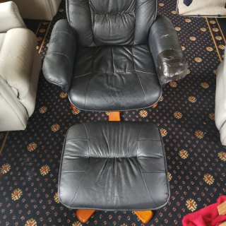 Reclining armchair with footstool